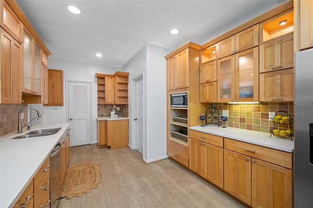 401 Whitcomb Blvd, Tarpon Springs, FL 34689 - kitchen with a sink, stainless steel appliances, tasteful backsplash, light countertops, and recessed lighting