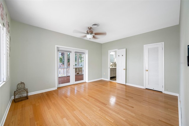 401 Whitcomb Blvd, Tarpon Springs, FL 34689 - unfurnished living room with a ceiling fan, light wood-type flooring, and baseboards