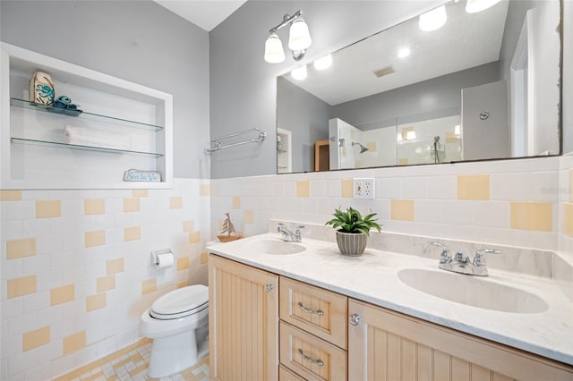 401 Whitcomb Blvd, Tarpon Springs, FL 34689 - bathroom featuring tile walls, toilet, walk in shower, and double vanity
