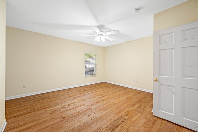 401 Whitcomb Blvd, Tarpon Springs, FL 34689 - unfurnished room with a ceiling fan, light wood-style flooring, and baseboards