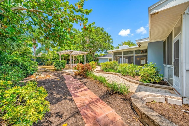 401 Whitcomb Blvd, Tarpon Springs, FL 34689 - view of yard with a pergola and a sunroom