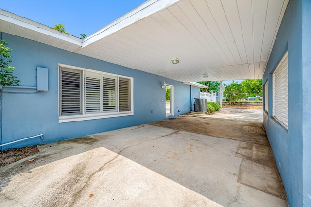 401 Whitcomb Blvd, Tarpon Springs, FL 34689 - view of patio / terrace featuring cooling unit and an attached carport