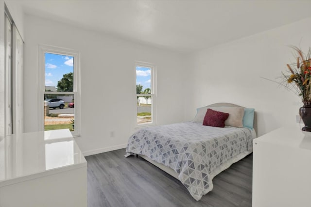 5875 Darren Ct N, Clearwater, FL 33760 - bedroom featuring wood finished floors and baseboards