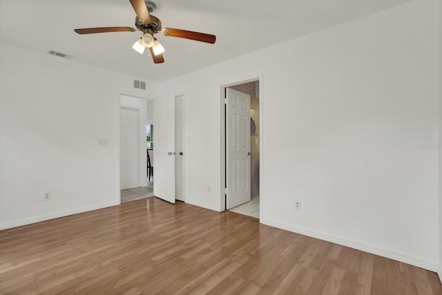 5875 Darren Ct N, Clearwater, FL 33760 - empty room with a ceiling fan, light wood-type flooring, and baseboards