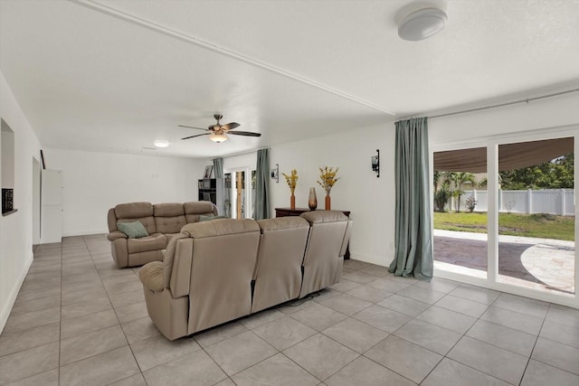 5875 Darren Ct N, Clearwater, FL 33760 - living room with light tile patterned floors, a ceiling fan, and baseboards
