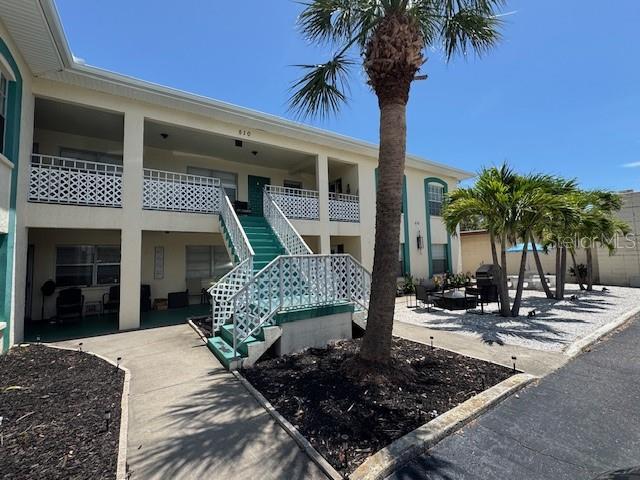 510 70th Ave, St Pete Beach, FL 33706 - view of building exterior featuring stairs