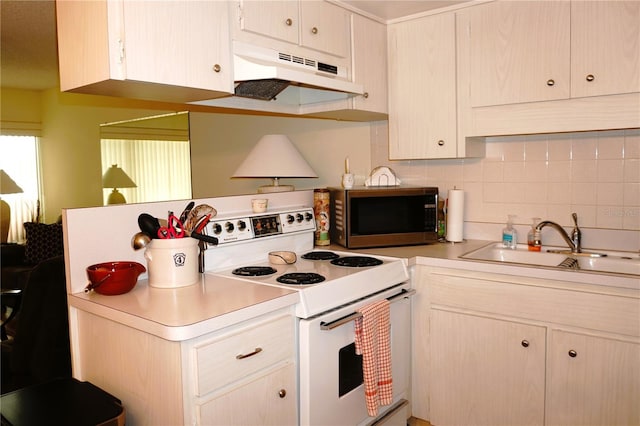 kitchen featuring stainless steel microwave, electric stove, under cabinet range hood, a sink, and light countertops