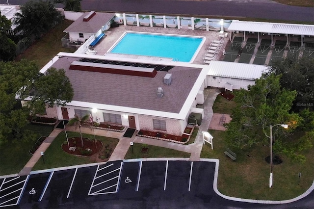 aerial view of property and surrounding area with a pool