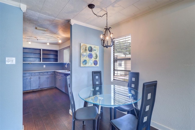 520 4th St NW, Largo, FL 33770 - dining area with a chandelier, dark wood-style flooring, ornamental molding, and baseboards