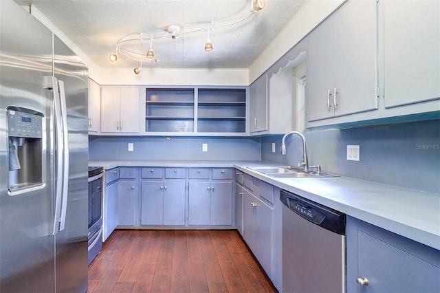 520 4th St NW, Largo, FL 33770 - kitchen with stainless steel appliances, a sink, open shelves, and light countertops