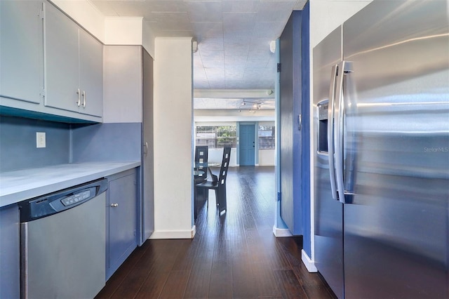 520 4th St NW, Largo, FL 33770 - kitchen with stainless steel appliances, dark wood-style floors, light countertops, and baseboards