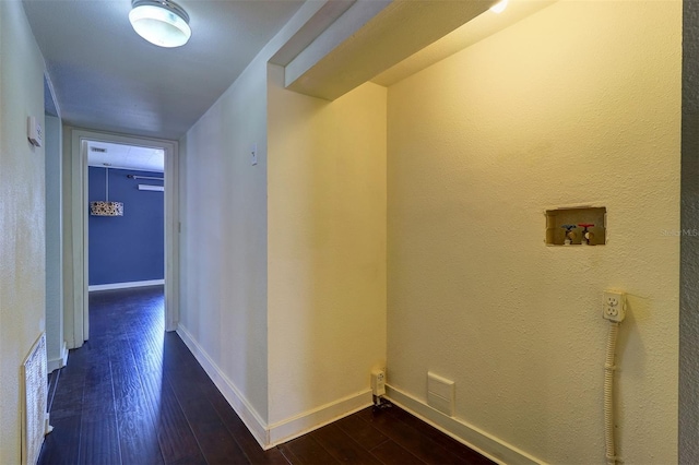 520 4th St NW, Largo, FL 33770 - hallway featuring dark wood-style floors and baseboards