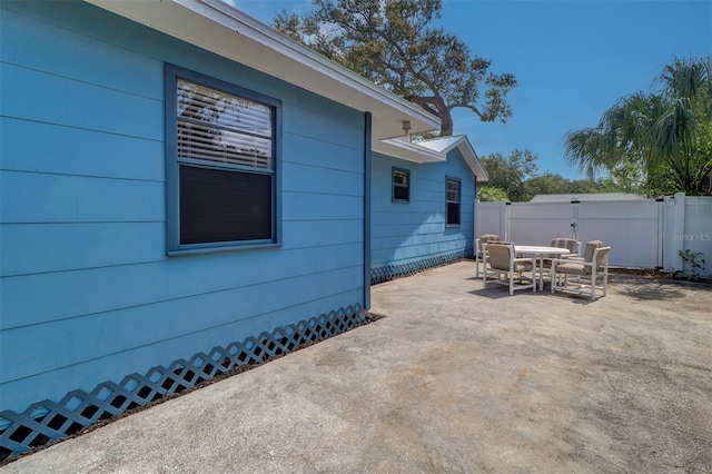 520 4th St NW, Largo, FL 33770 - view of patio with outdoor dining area and fence