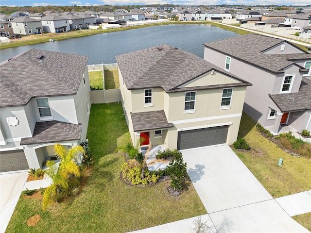 9313 Lemon Drop Loop, Sun City Center, FL 33573 - view of front facade featuring a residential view, stucco siding, and a water view