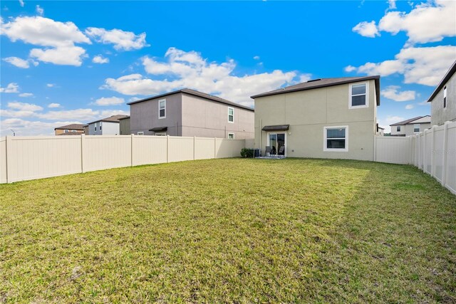 9313 Lemon Drop Loop, Sun City Center, FL 33573 - back of house with stucco siding