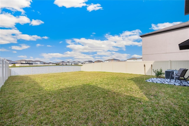 9313 Lemon Drop Loop, Sun City Center, FL 33573 - view of yard featuring a residential view, central air condition unit, and a patio