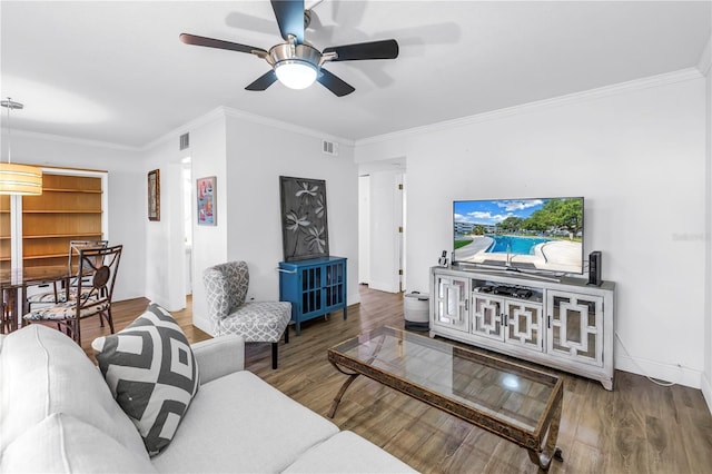 7801 11th St N Unit 104, Saint Petersburg, FL 33702 - living room with baseboards, wood finished floors, ornamental molding, and a ceiling fan