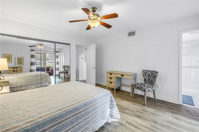 7801 11th St N Unit 104, Saint Petersburg, FL 33702 - bedroom featuring wood finished floors, baseboards, and ceiling fan
