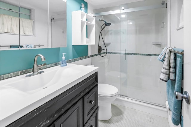 7801 11th St N Unit 104, Saint Petersburg, FL 33702 - bathroom featuring toilet, a stall shower, vanity, and tile patterned floors