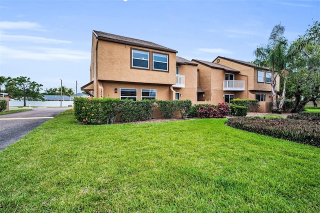 1864 Clearbrooke Dr, Clearwater, FL 33760 - townhome / multi-family property with stucco siding and a front lawn