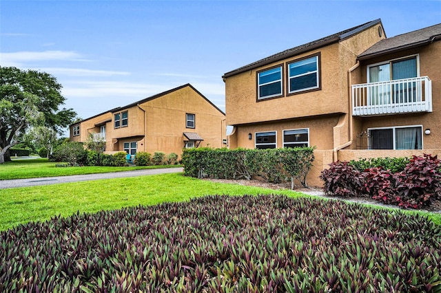 1864 Clearbrooke Dr, Clearwater, FL 33760 - view of front of property featuring a front yard and stucco siding