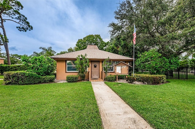 1864 Clearbrooke Dr, Clearwater, FL 33760 - view of front of house with stucco siding and a shingled roof