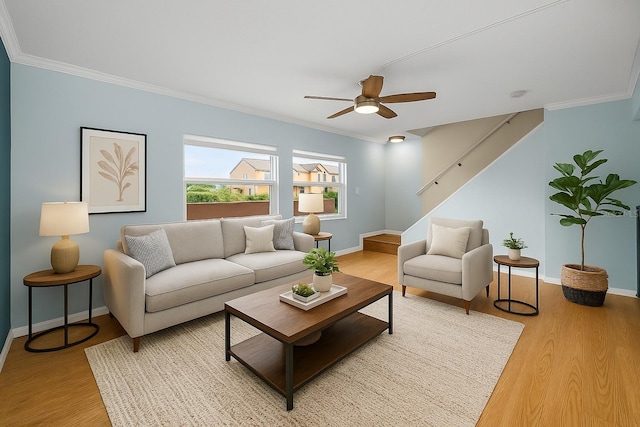 1864 Clearbrooke Dr, Clearwater, FL 33760 - living room with light wood-style flooring, baseboards, crown molding, and ceiling fan