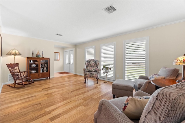 535 Sandy Hook, Palm Harbor, FL 34683 - living room featuring light wood-type flooring, ornamental molding, and baseboards
