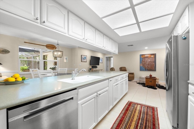 535 Sandy Hook, Palm Harbor, FL 34683 - kitchen with appliances with stainless steel finishes, a sink, white cabinetry, light tile patterned floors, and light countertops