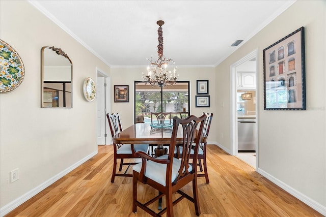 535 Sandy Hook, Palm Harbor, FL 34683 - dining area with a chandelier, light wood-type flooring, baseboards, and ornamental molding