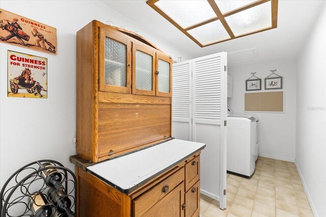 535 Sandy Hook, Palm Harbor, FL 34683 - washroom featuring washer / dryer and baseboards