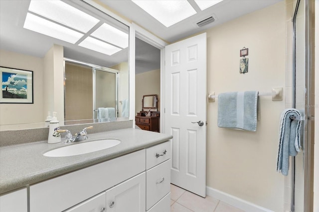 535 Sandy Hook, Palm Harbor, FL 34683 - bathroom with tile patterned floors, vanity, a shower stall, and baseboards