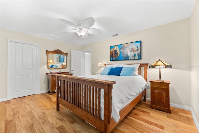 535 Sandy Hook, Palm Harbor, FL 34683 - bedroom featuring baseboards, light wood-type flooring, a ceiling fan, and a closet