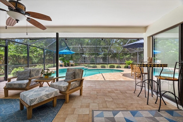 535 Sandy Hook, Palm Harbor, FL 34683 - swimming pool featuring a patio area, glass enclosure, and an outdoor living space
