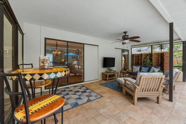535 Sandy Hook, Palm Harbor, FL 34683 - living room with ceiling fan, a chandelier, and light stone finish flooring