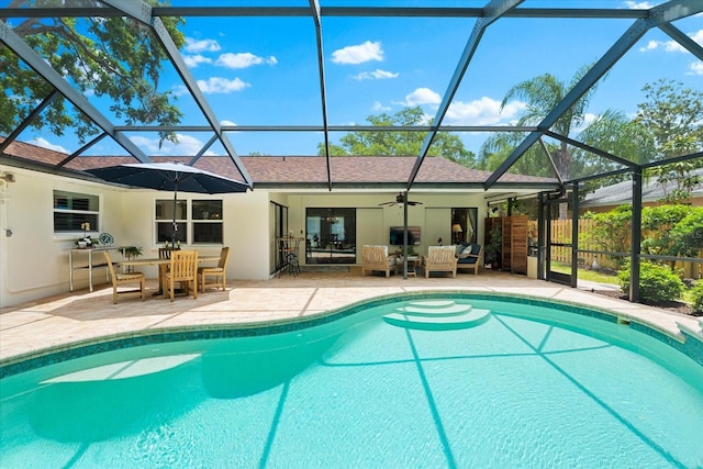535 Sandy Hook, Palm Harbor, FL 34683 - view of swimming pool with a patio, an outdoor living space, a lanai, ceiling fan, and outdoor dining space