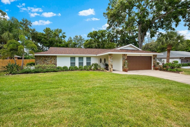 535 Sandy Hook, Palm Harbor, FL 34683 - view of front of house featuring a garage, stone siding, concrete driveway, and stucco siding