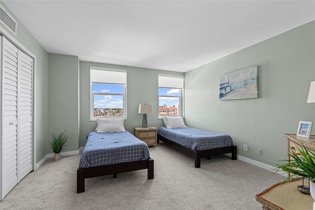 bedroom with carpet and baseboards