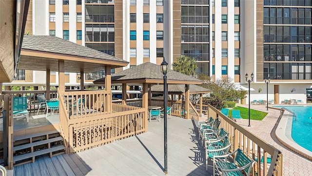 view of home's community featuring a gazebo, a deck, and a pool