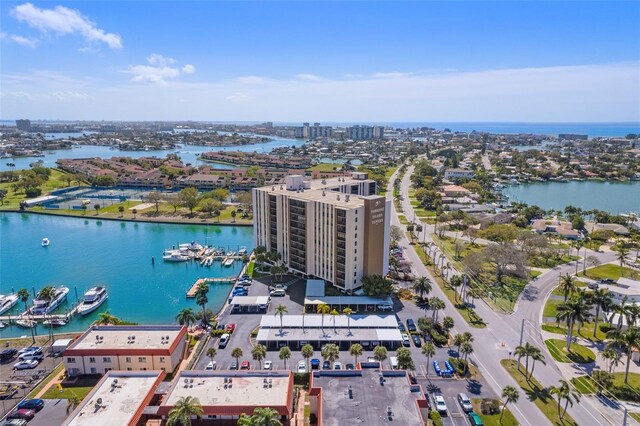 view of urban area with a nearby body of water and a marina
