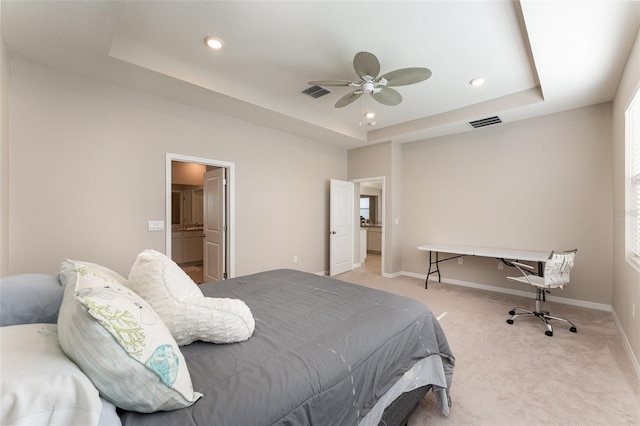 bedroom featuring a raised ceiling, light colored carpet, baseboards, recessed lighting, and a ceiling fan