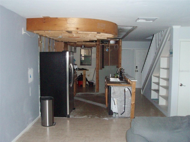 2980 Haines Bayshore Rd Unit 124, Clearwater, FL 33760 - kitchen with freestanding refrigerator, light tile patterned floors, and a sink