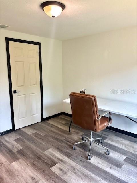 6906 W Barbara Ann Ln, Homosassa, FL 34446 - office area featuring wood finished floors and baseboards