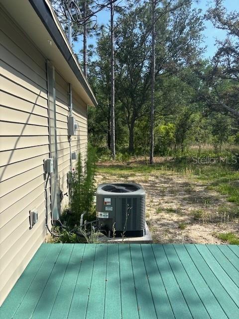 6906 W Barbara Ann Ln, Homosassa, FL 34446 - wooden terrace featuring cooling unit