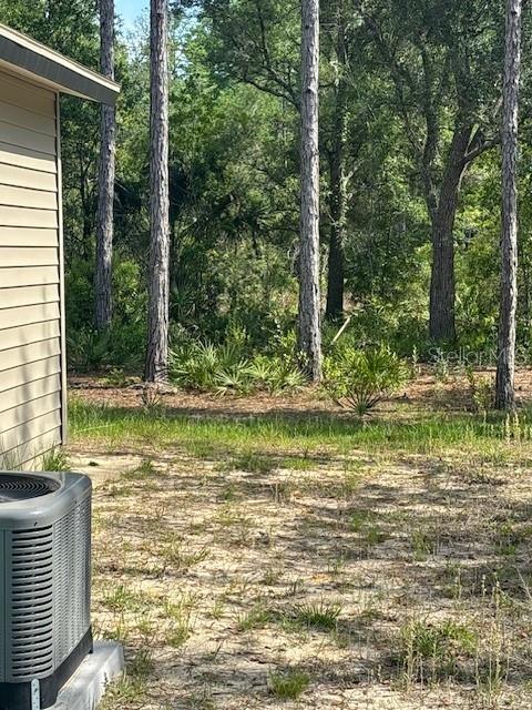 6906 W Barbara Ann Ln, Homosassa, FL 34446 - view of yard with central AC unit