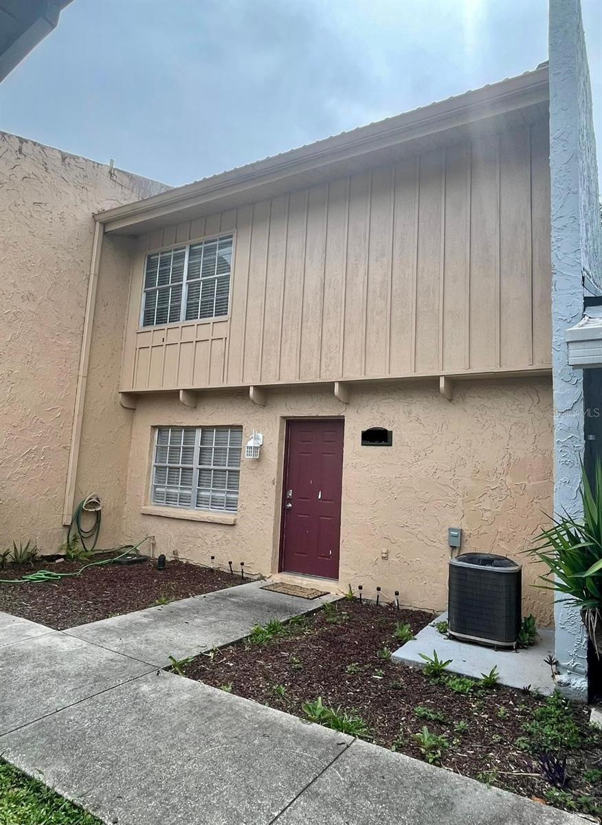 4967 Steel Dust Ln, Lutz, FL 33559 - view of exterior entry with central AC