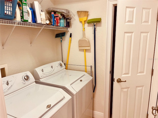 184 Banyan Bay Dr, Saint Petersburg, FL 33705 - washroom featuring separate washer and dryer and a textured wall