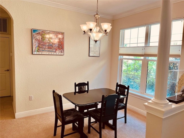 184 Banyan Bay Dr, Saint Petersburg, FL 33705 - dining space with carpet flooring, plenty of natural light, ornate columns, ornamental molding, and a textured wall