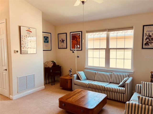 184 Banyan Bay Dr, Saint Petersburg, FL 33705 - living room with carpet flooring, baseboards, a ceiling fan, and lofted ceiling