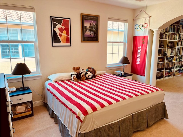184 Banyan Bay Dr, Saint Petersburg, FL 33705 - carpeted bedroom with arched walkways and ornate columns